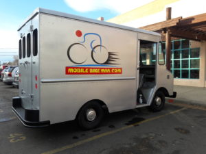 New Mobile Bike Shop Repair Van restoration progress showing silver van with Mobilebikeman.com logo on the side