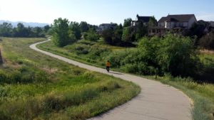 Cyclist on Spring Gulch Trail in Highlands Ranch Area